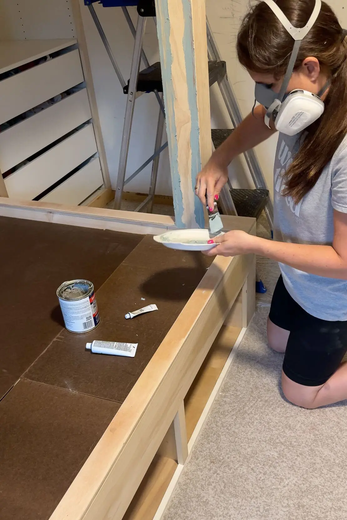 Using bondo to fill seams on my DIY bunk beds.
